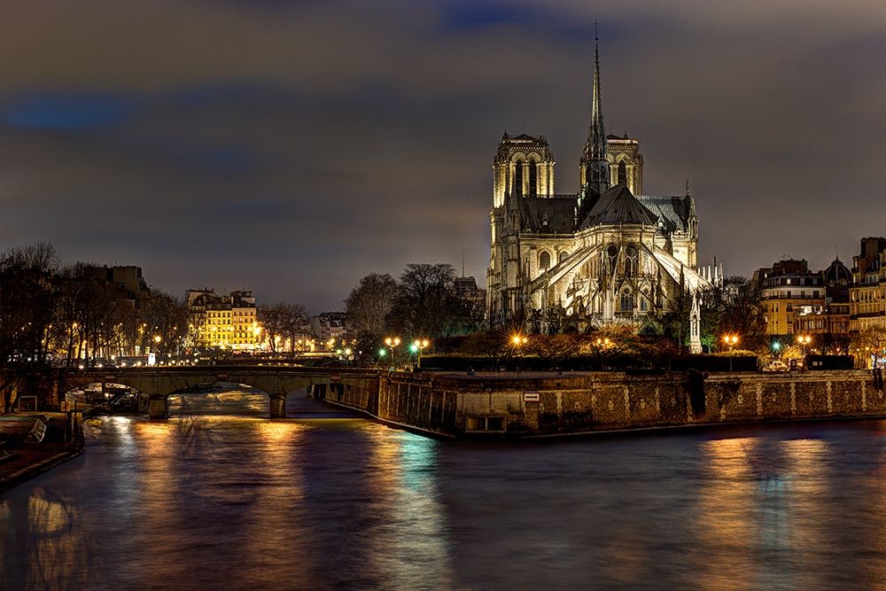 Notre Dame Cathedral and the Seine River shimmer in the Paris-France night art print by Steve Mohlenkamp for $57.95 CAD